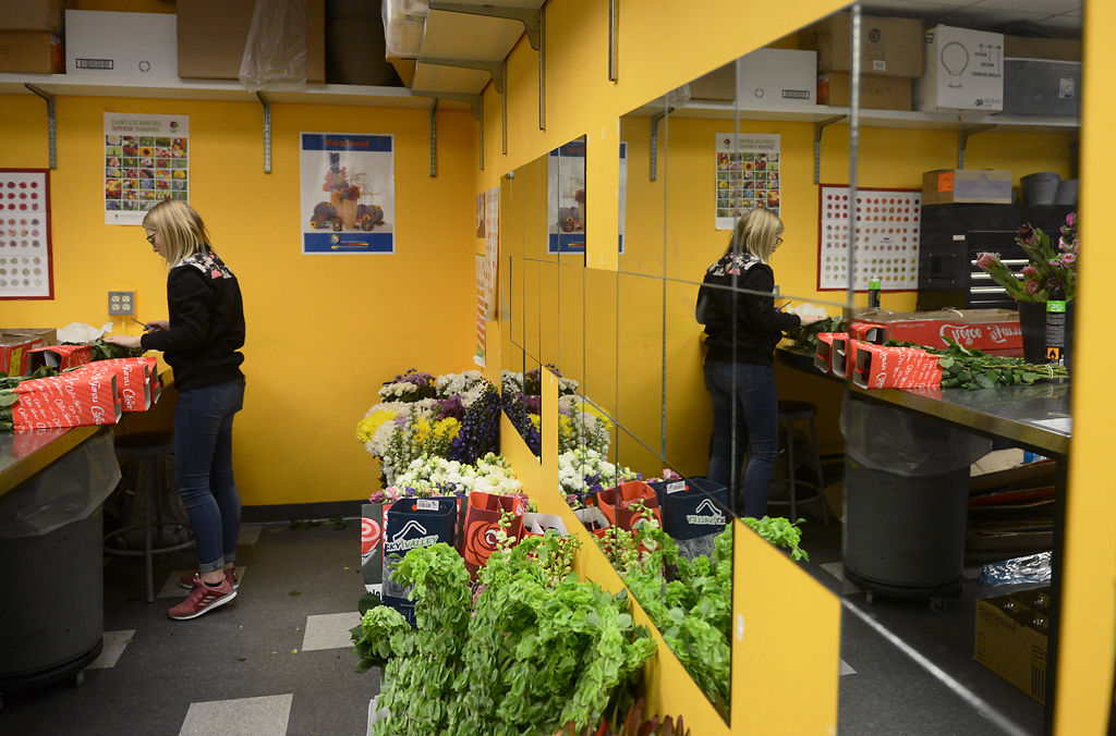 Katelyn Reiss unpacks flowers